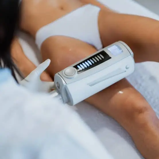 A lower-leg drainage session in progress on a treatment couch